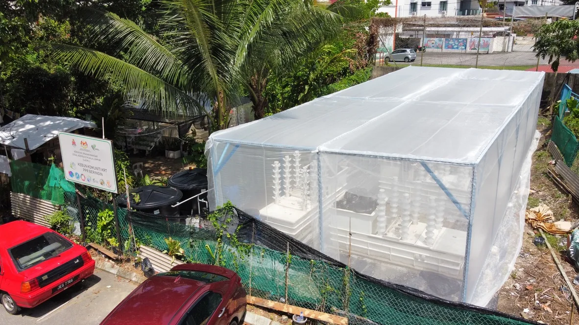 PPR Beringin Community Farm protected growing structure with HAVVA vertical systems visible inside